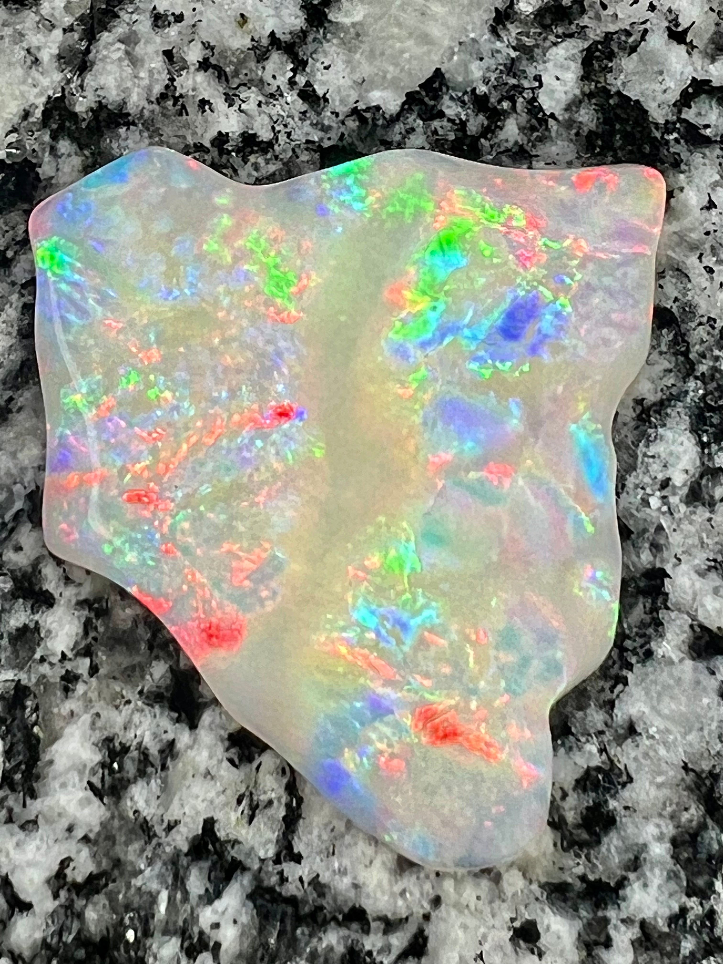 51,36 ct multi patern red fire everywhere bigg opal