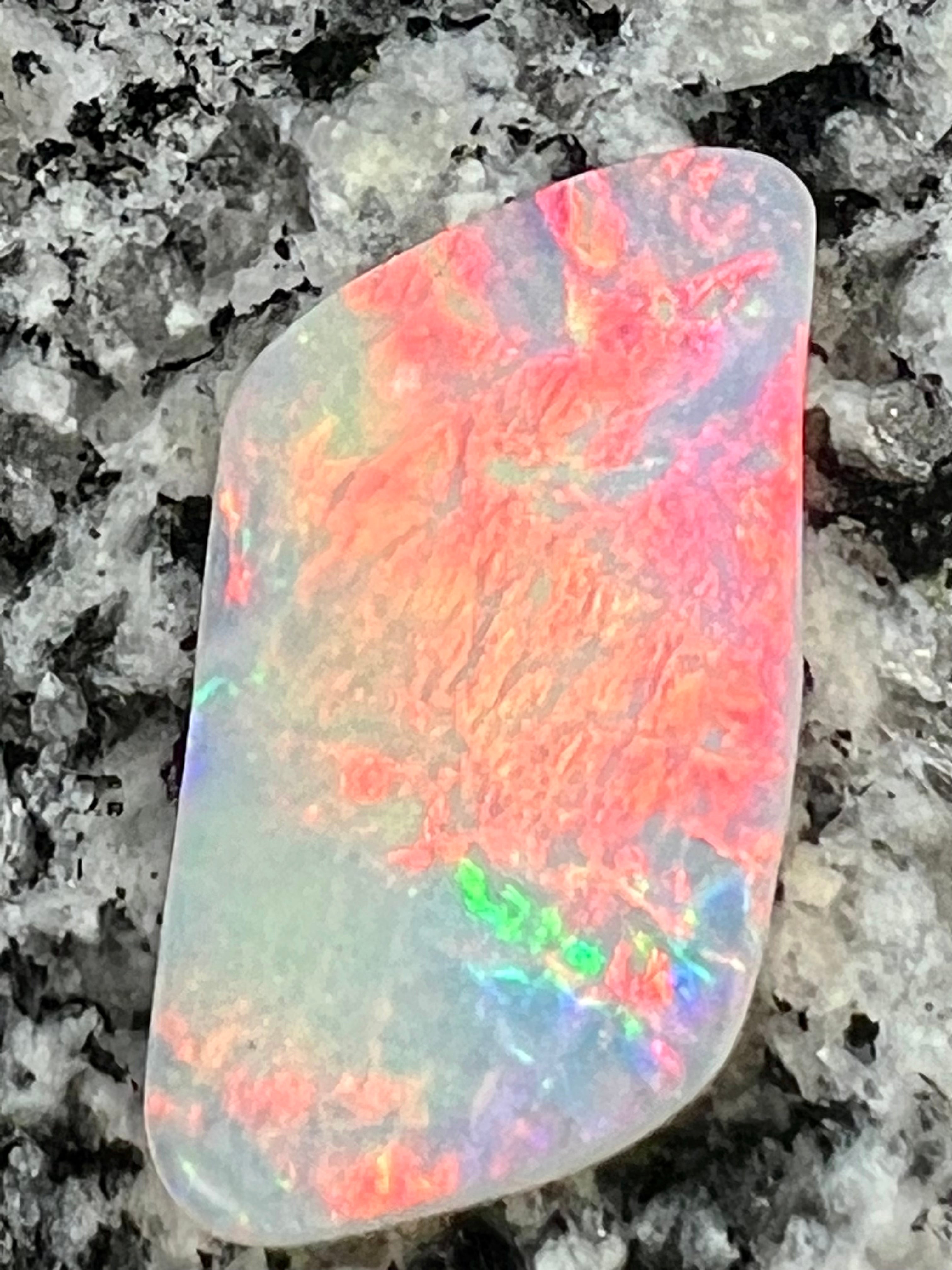 12,76 ct red fire everywhere bigg opal