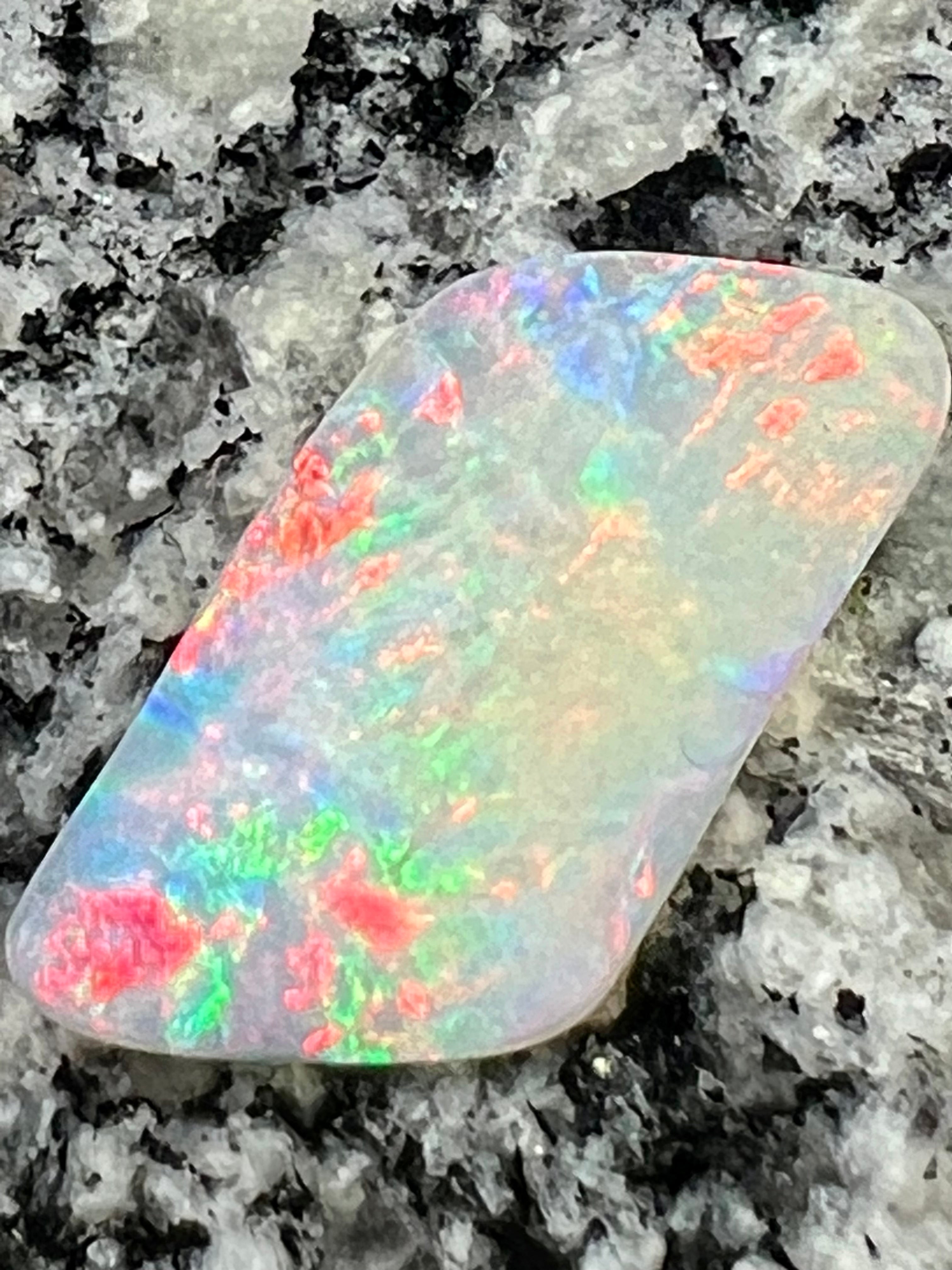 12,76 ct red fire everywhere bigg opal