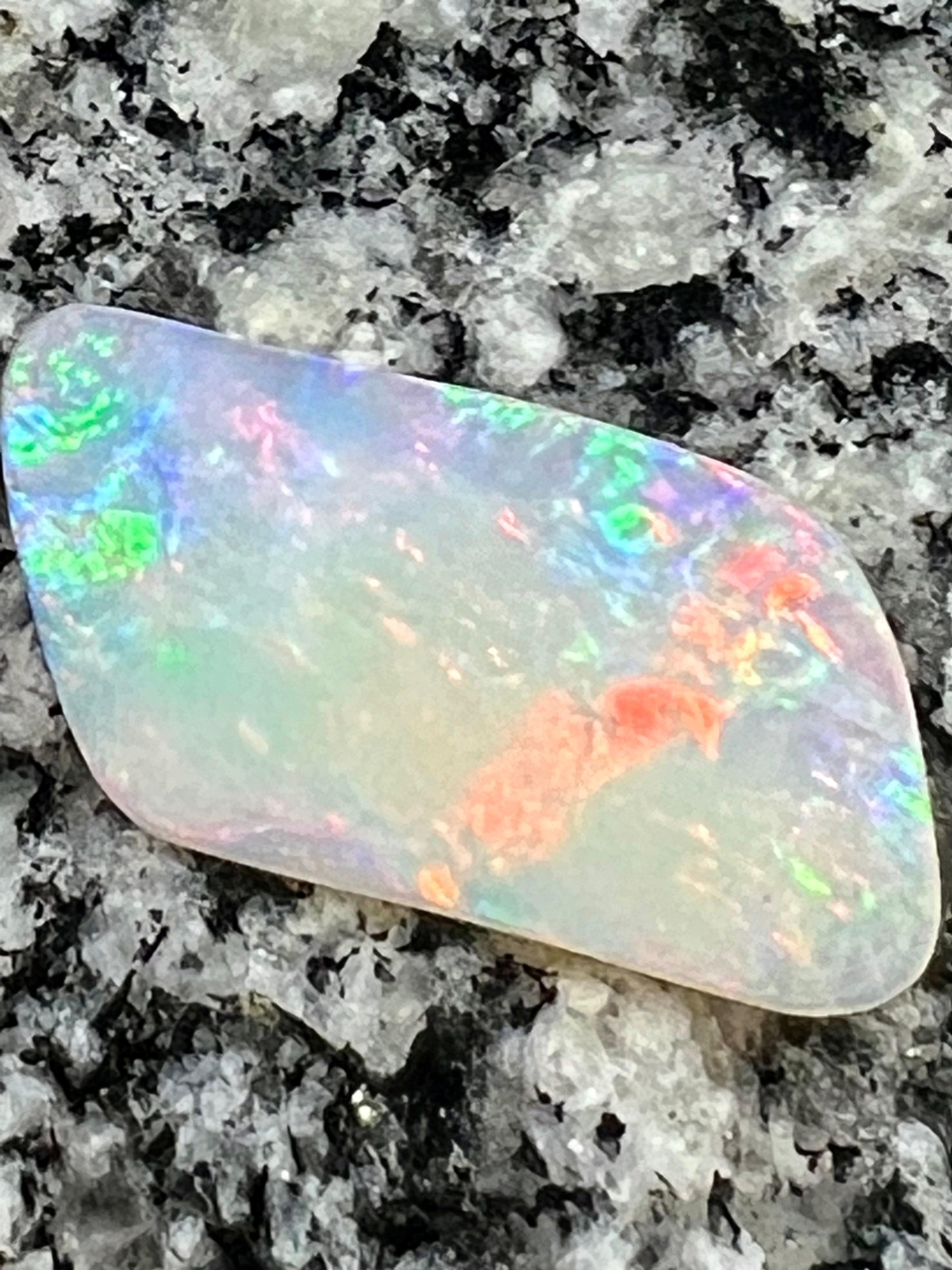 12,76 ct red fire everywhere bigg opal