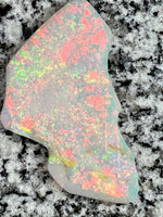 Load image into Gallery viewer, Sold. 67,3 ct this opal is on fire red everywhere
