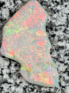 Sold. 67,3 ct this opal is on fire red everywhere