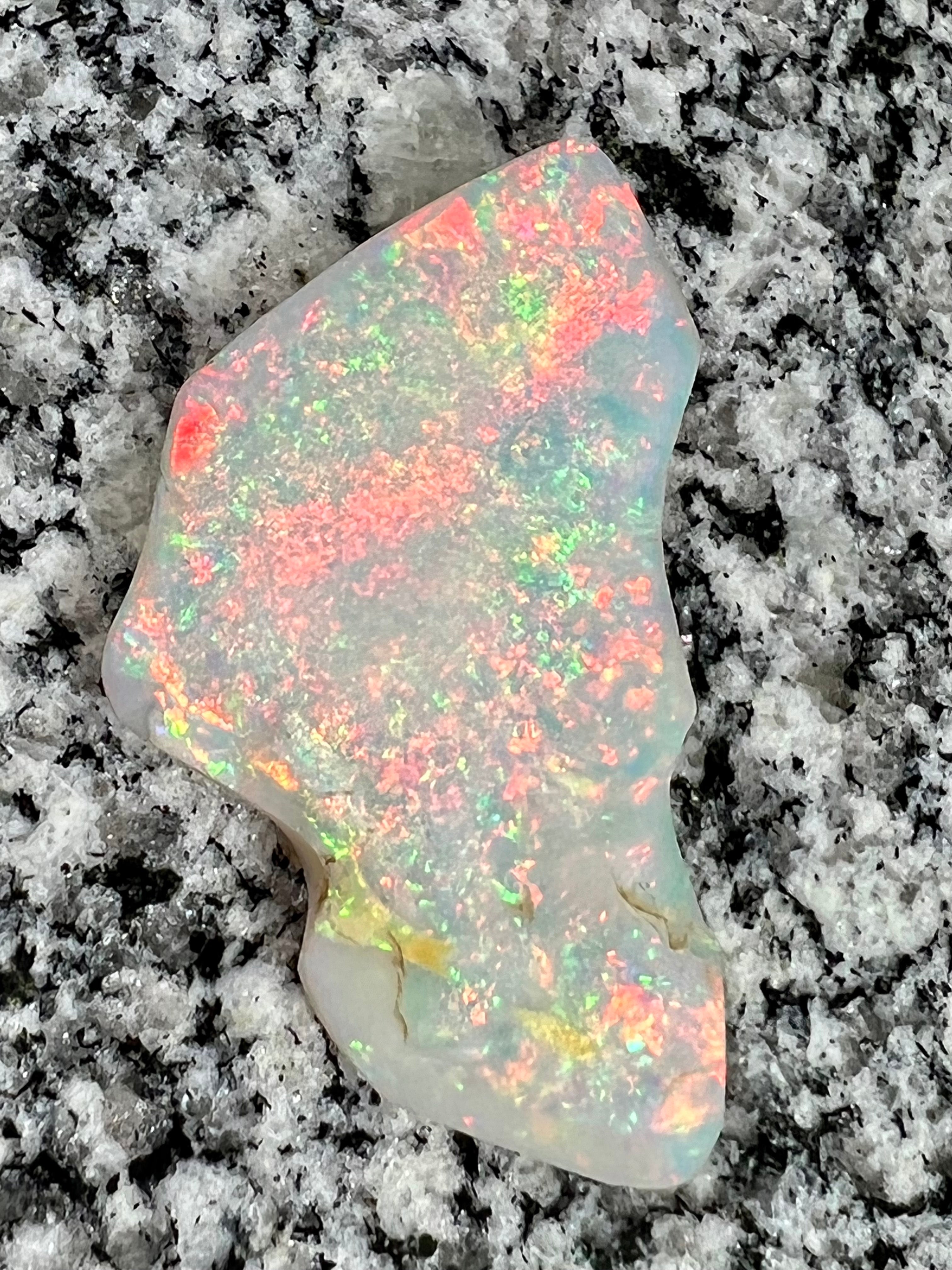 Sold. 67,3 ct this opal is on fire red everywhere