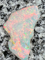 Load image into Gallery viewer, Sold. 67,3 ct this opal is on fire red everywhere
