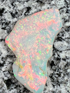 Sold. 67,3 ct this opal is on fire red everywhere