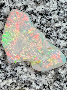 Sold. 67,3 ct this opal is on fire red everywhere