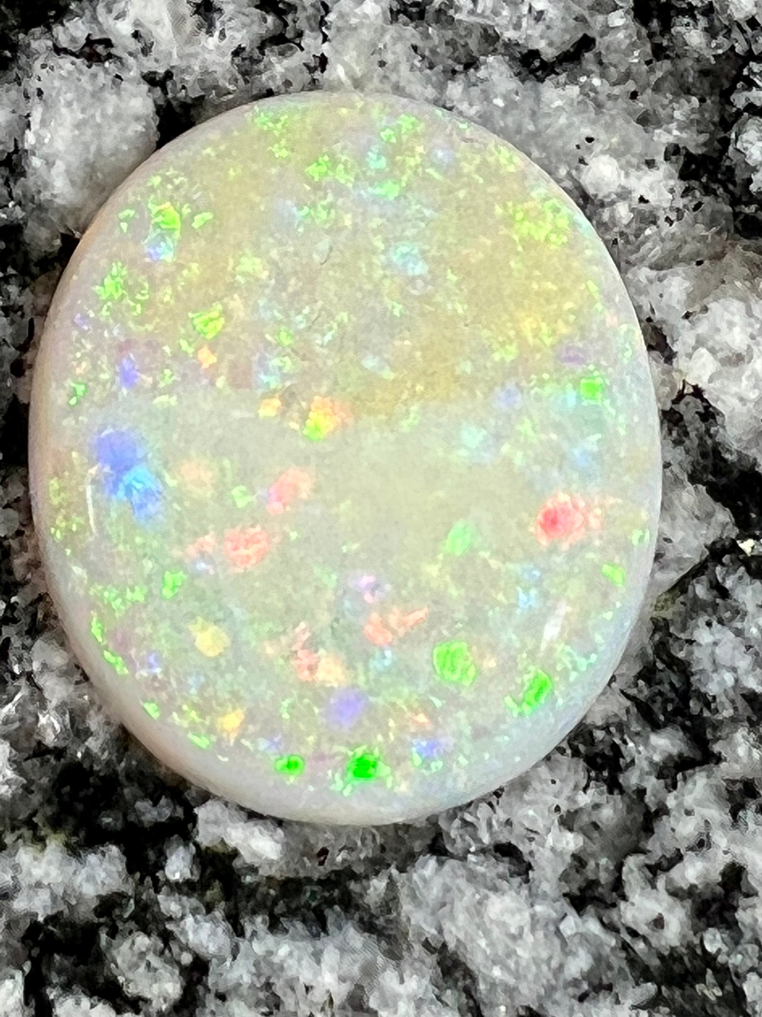 19,73ct  bigg fully saturated multi patern oval opal