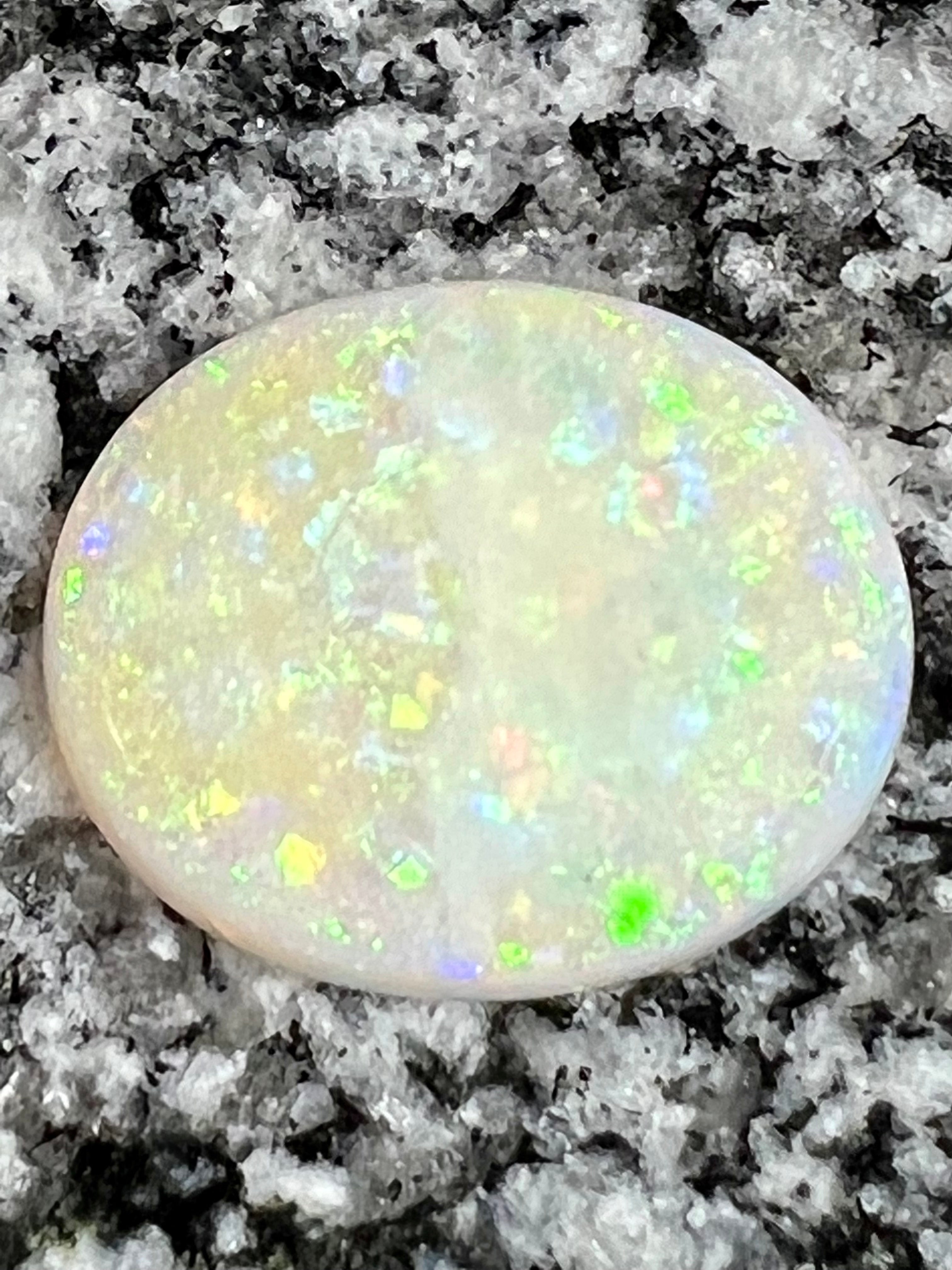 19,73ct  bigg fully saturated multi patern oval opal