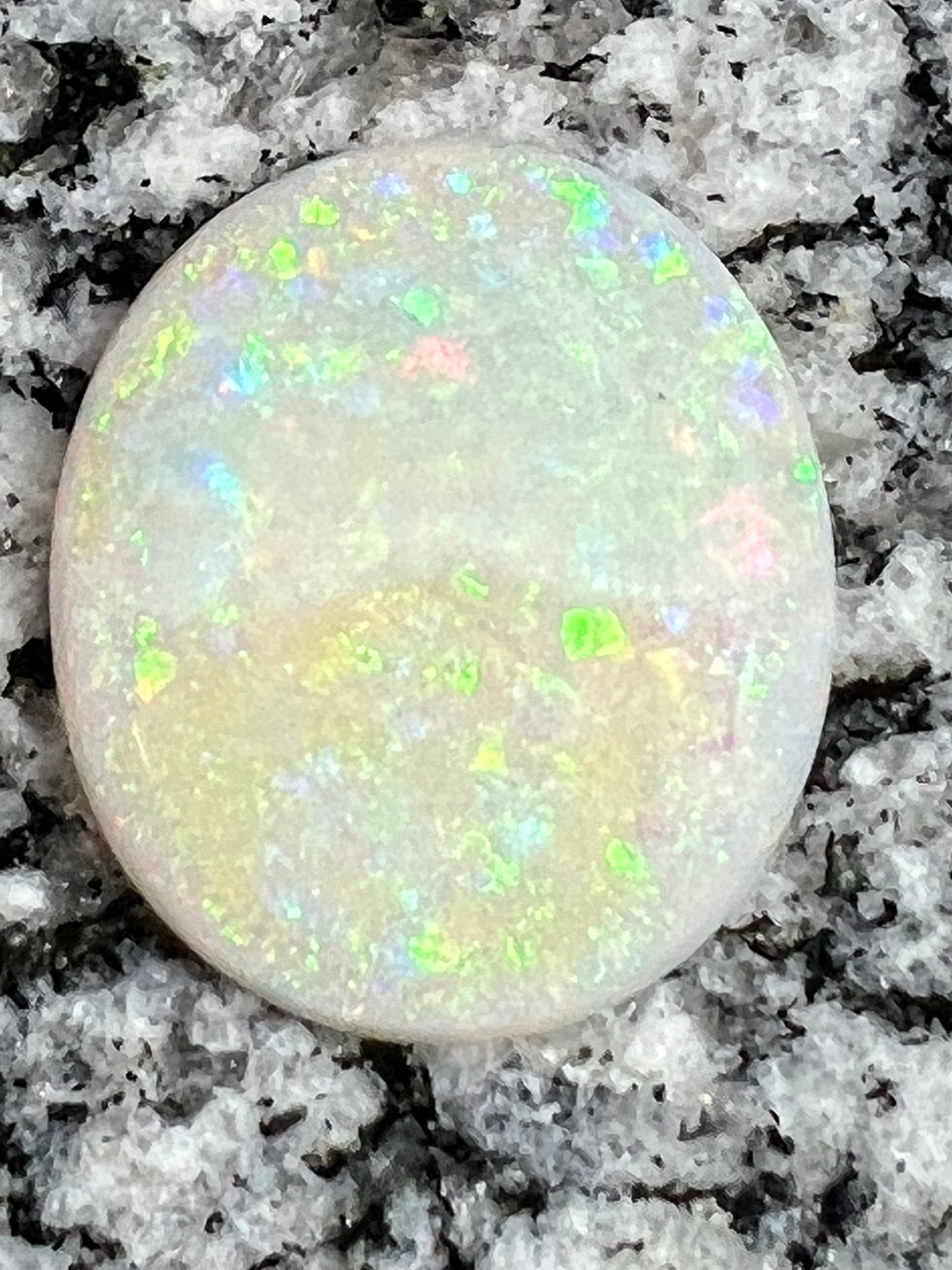 19,73ct  bigg fully saturated multi patern oval opal