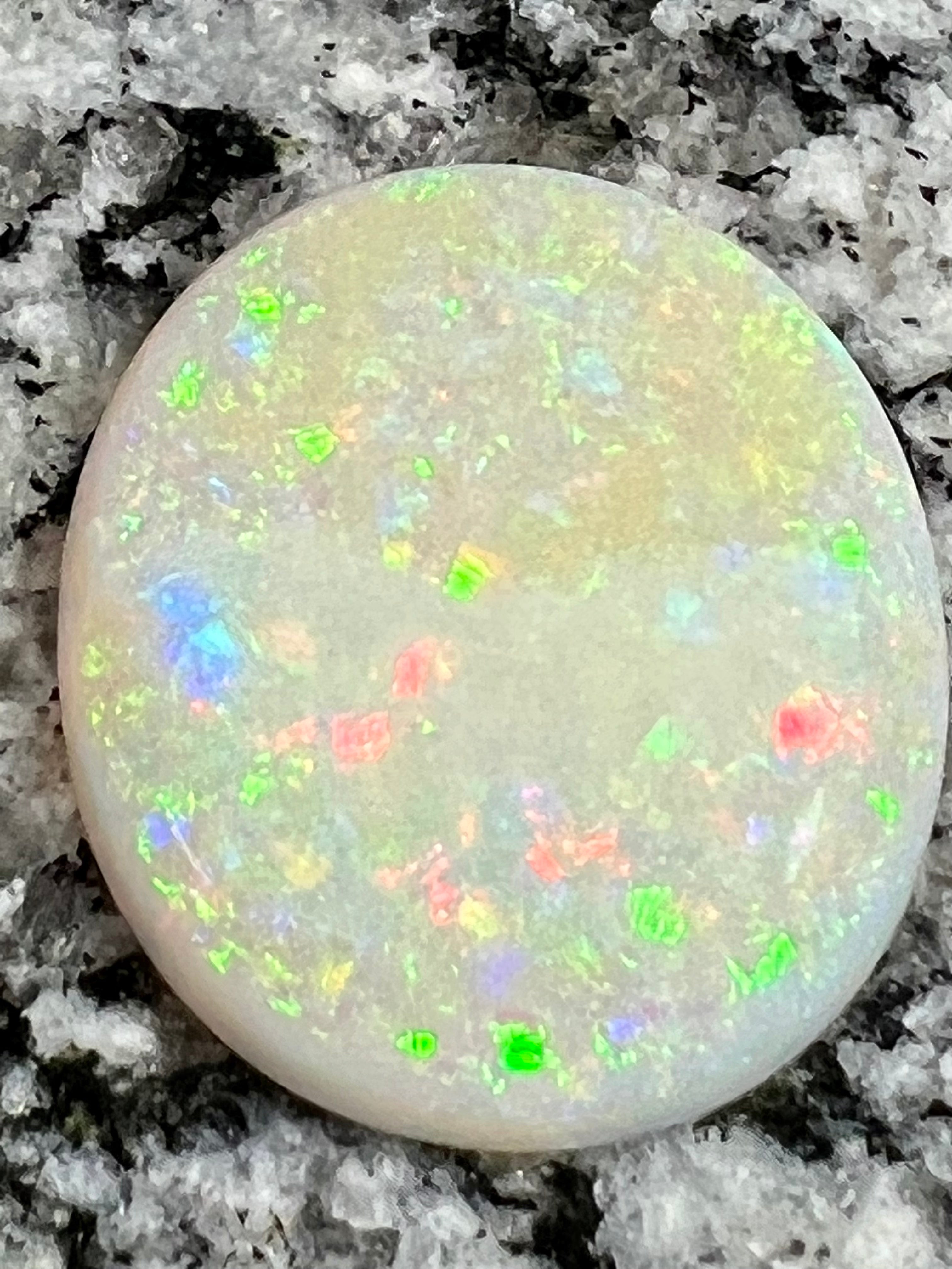 19,73ct  bigg fully saturated multi patern oval opal