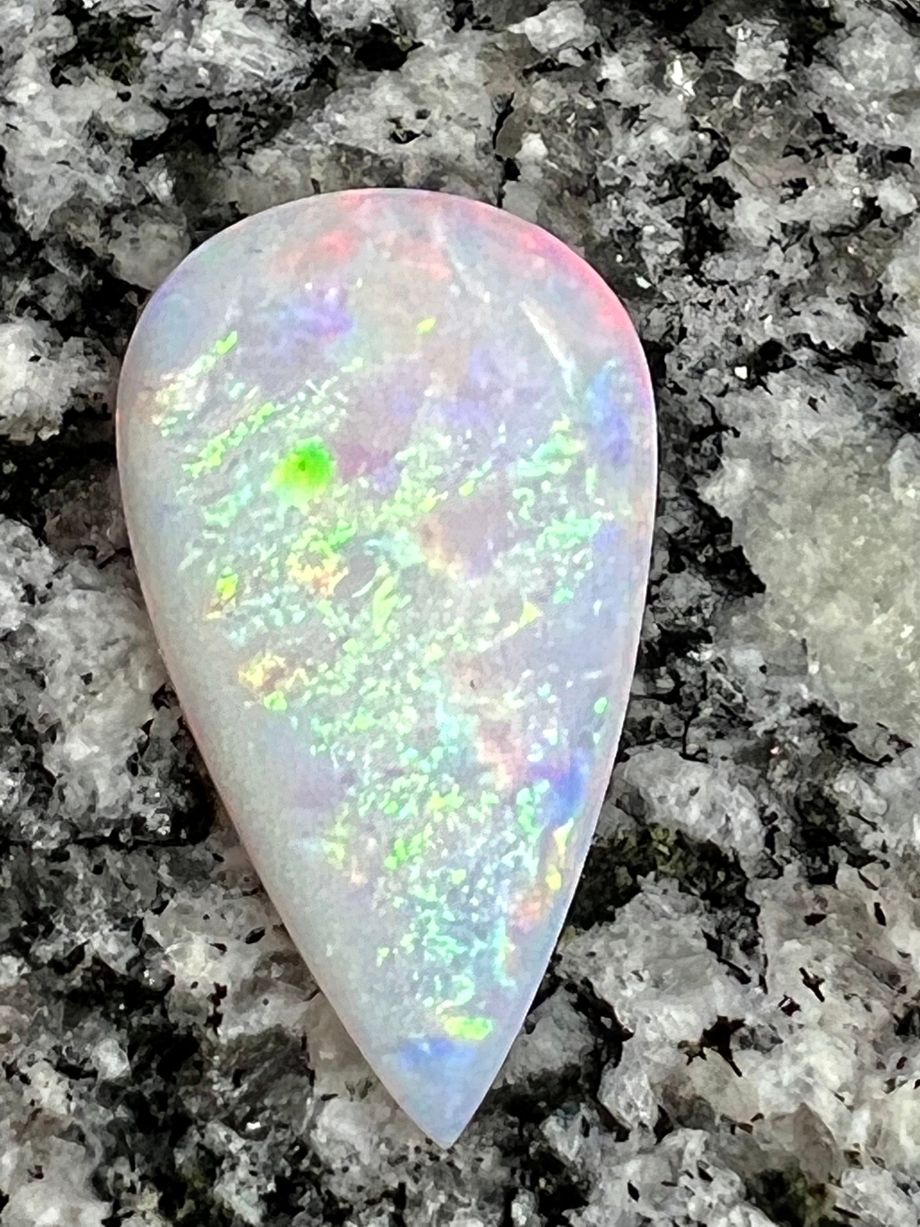 13,8 ct rolling flash fire patern teardrop opal