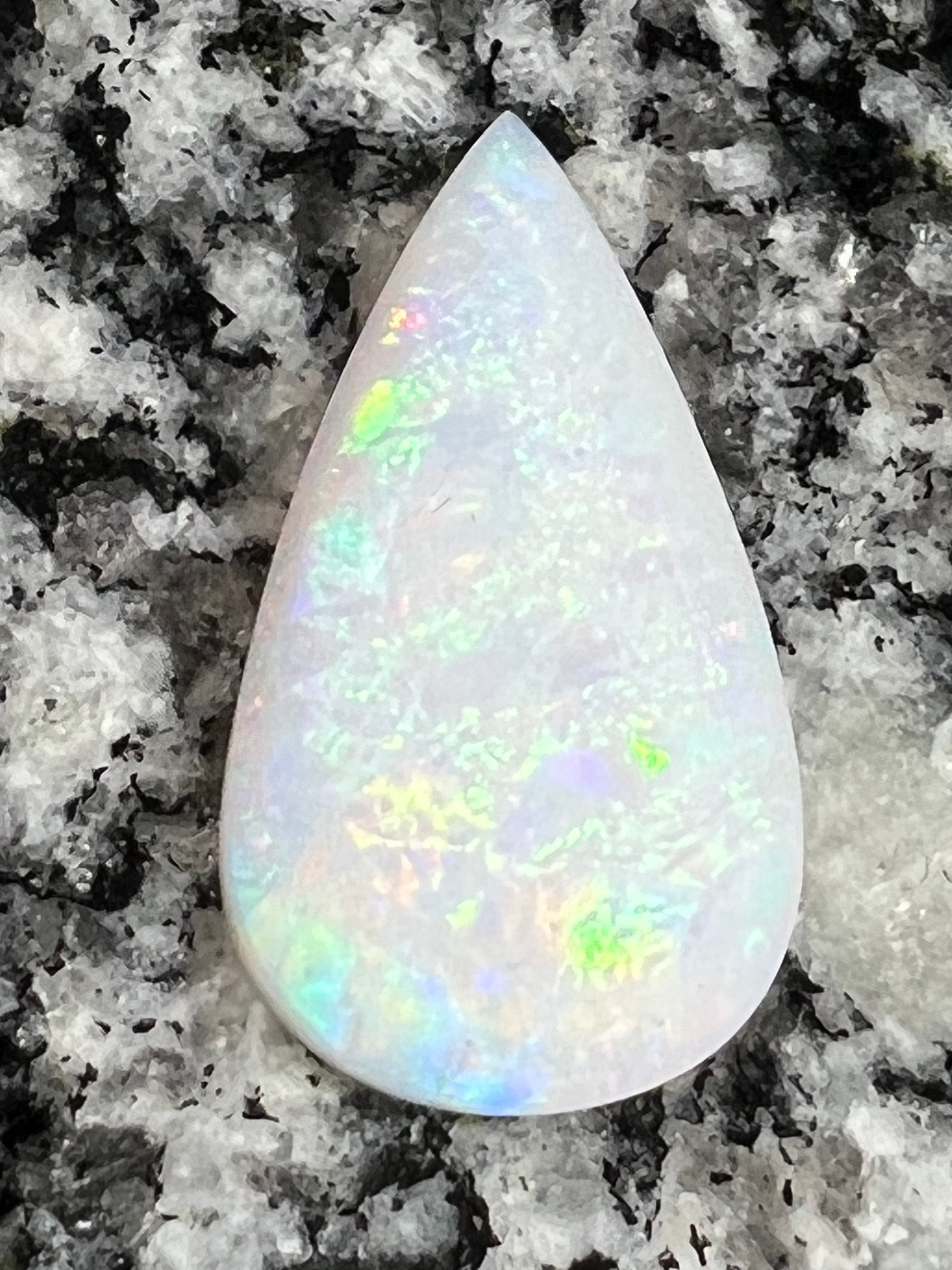 13,8 ct rolling flash fire patern teardrop opal