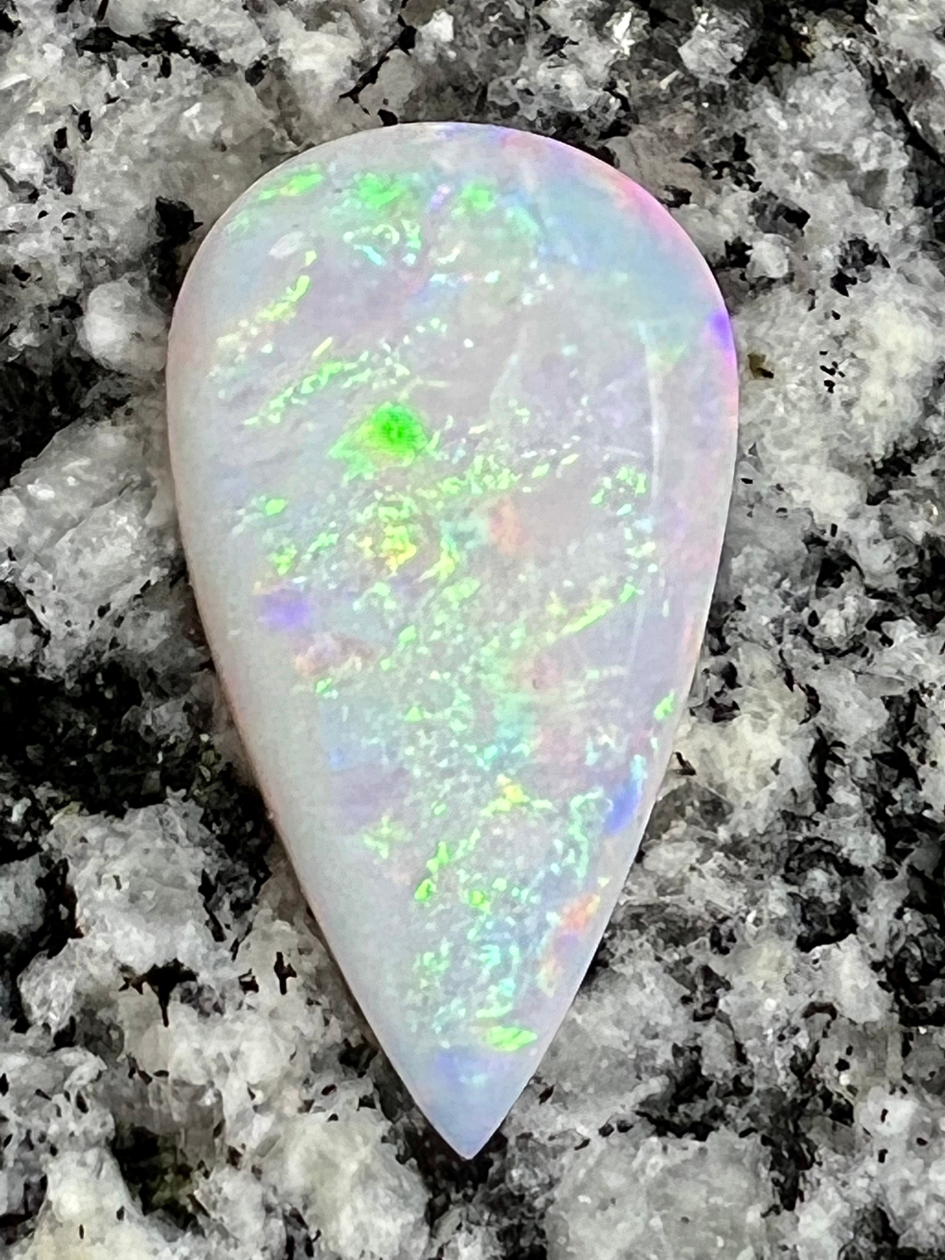 13,8 ct rolling flash fire patern teardrop opal