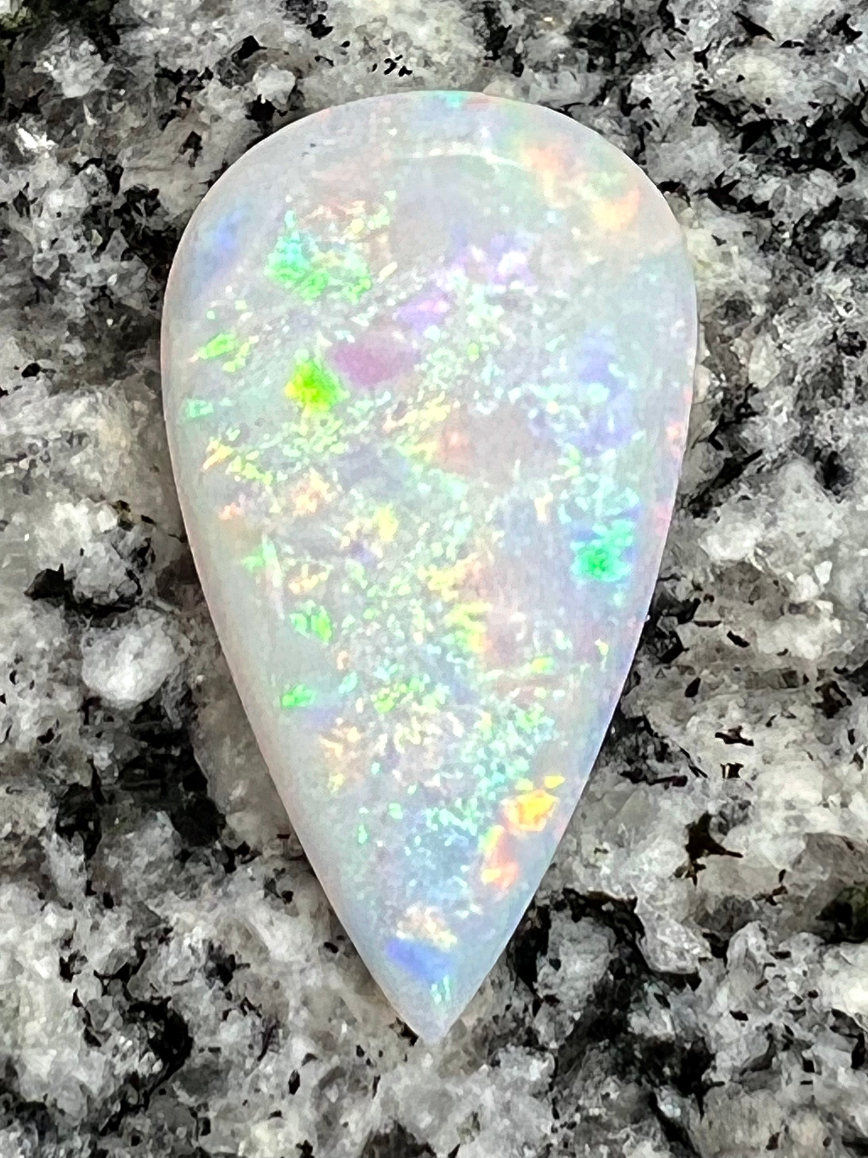 13,8 ct rolling flash fire patern teardrop opal