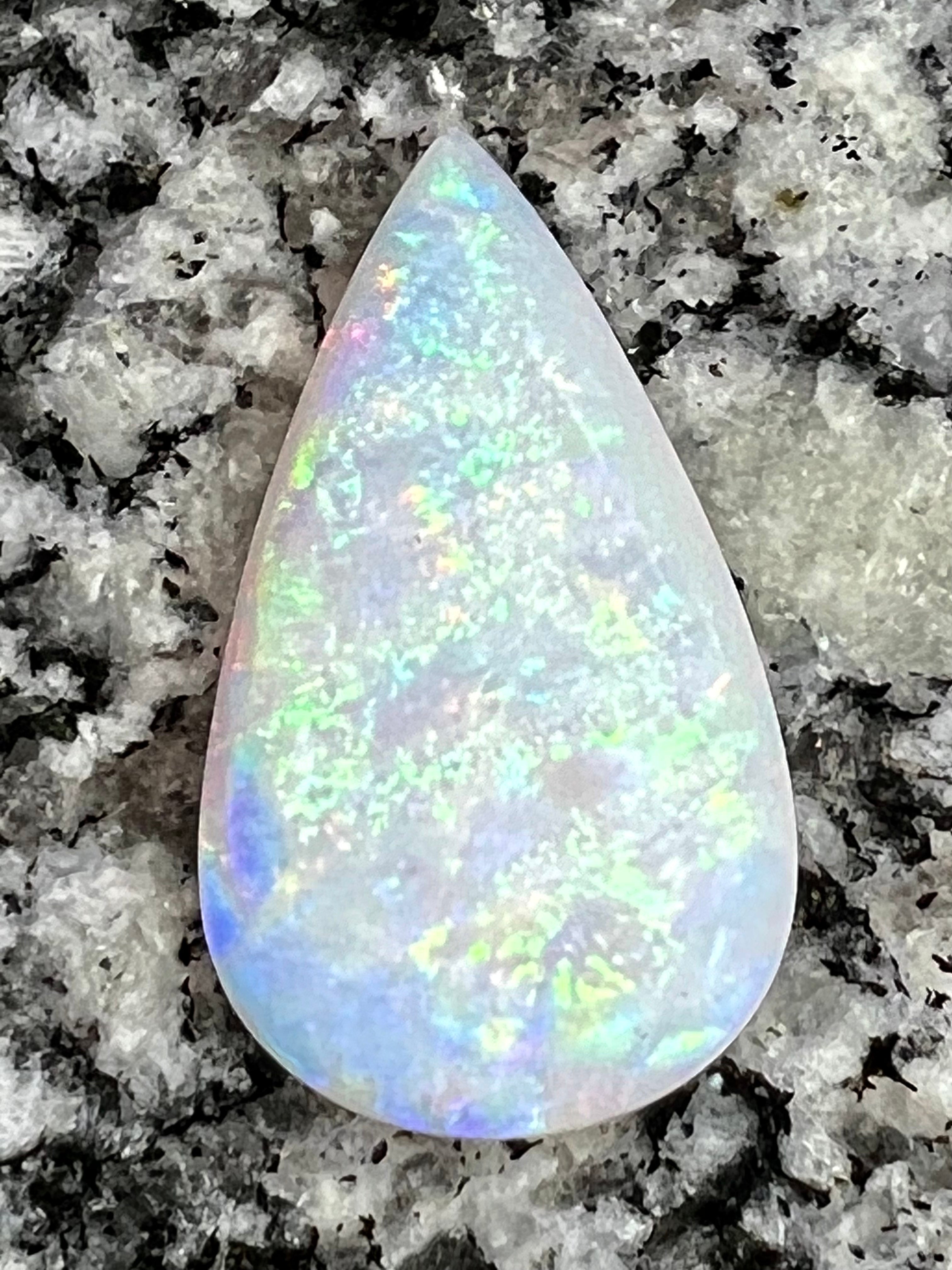 13,8 ct rolling flash fire patern teardrop opal