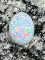 Load image into Gallery viewer, 7,4 ct fully saturated multi colour’s oval opal
