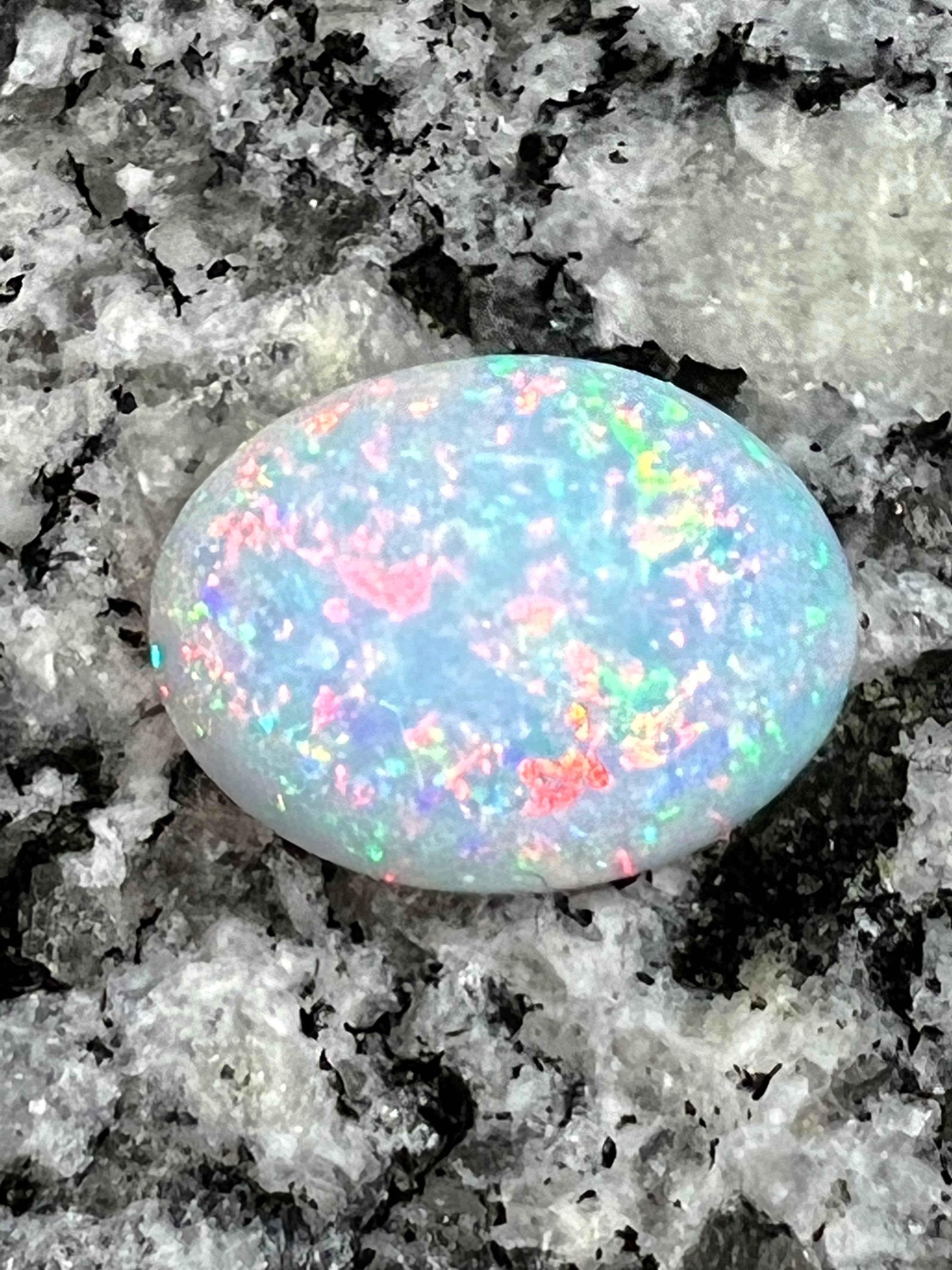 7,4 ct fully saturated multi colour’s oval opal