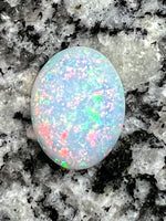 Load image into Gallery viewer, 7,4 ct fully saturated multi colour’s oval opal
